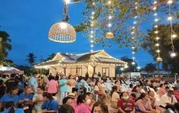 A group of people sitting outside

Description automatically generated