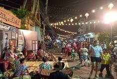 A group of people in a street

Description automatically generated